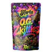 O.G. Zkittles 24% THCA hybrid-toppskott med frostat trichomlager på svart bakgrund